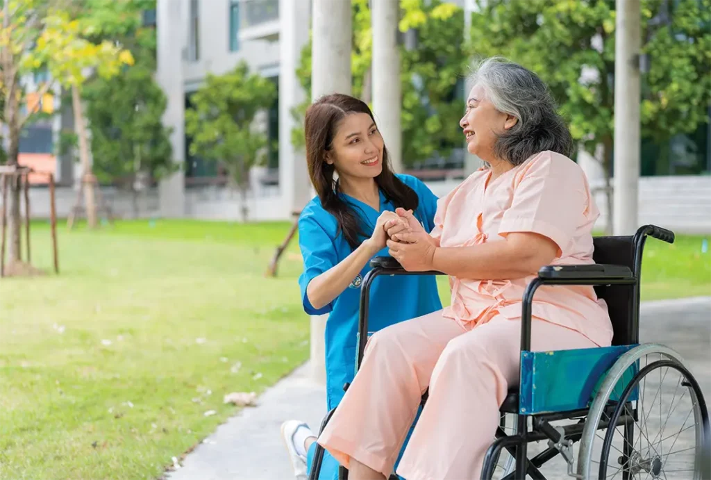 Caregiver or nurse holding the patients hand